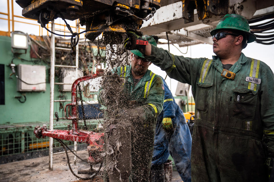 Oil workers, known as roughnecks, extracting oil at a Midland rig in May 2018; many laborers earn six-figure salaries because of high demand