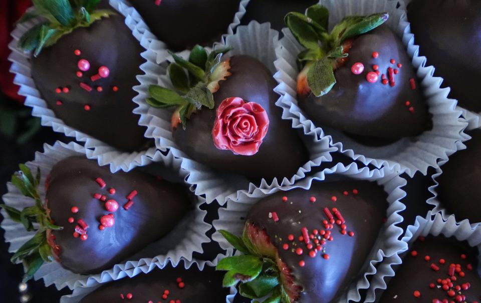 Decorated chocolate covered strawberries sit on a desert table Saturday, April 8, 2023 at Grand Hall in Indianapolis.