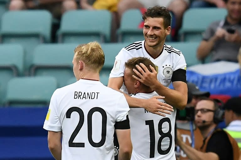 Germany's midfielder Leon Goretzka is congratulated by Germany's defender Joshua Kimmich after he scored a goal on June 19, 2017