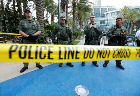 Orange County Sheriff deputies stand watch outdoors before Republican U.S. Presidential candidate Donald Trump speaks at a campaign event in Anaheim, California U.S. May 25, 2016. REUTERS/Mike Blake