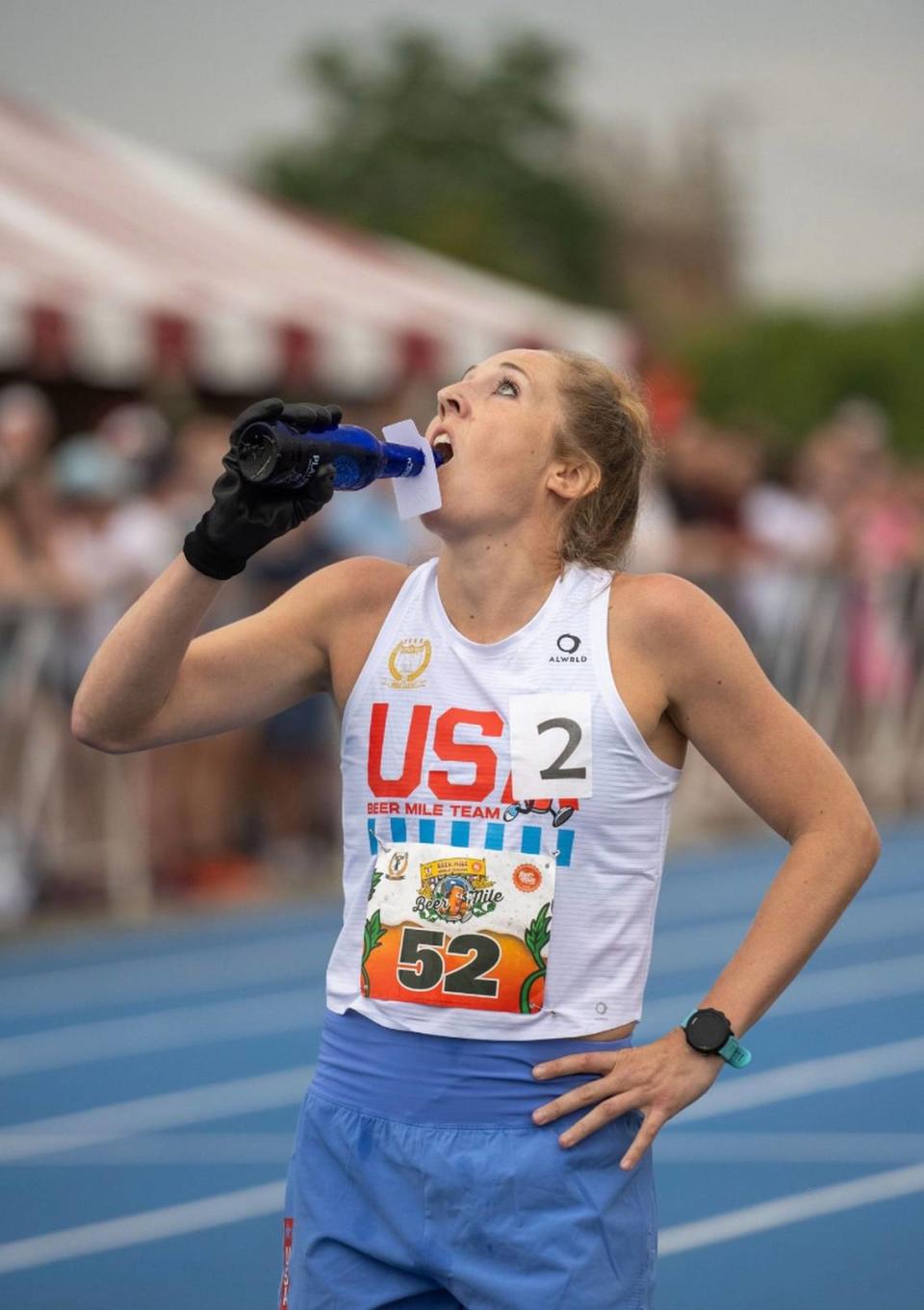 Elizabeth Laseter chugs a beer at the Beer Mile World Classic in Chicago this past July. Elvis Marin