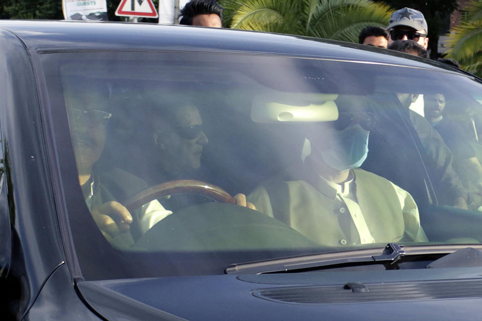 A car carrying Pakistan's former Prime Minister Imran Khan, center back, arrives at at Supreme Court for his court appearance, in Islamabad, Pakistan, Thursday, May 11, 2023. Pakistan's Supreme Court on Thursday ordered the release of Khan, whose arrest earlier this week sparked a wave of violence across the country by his supporters. (AP Photo)