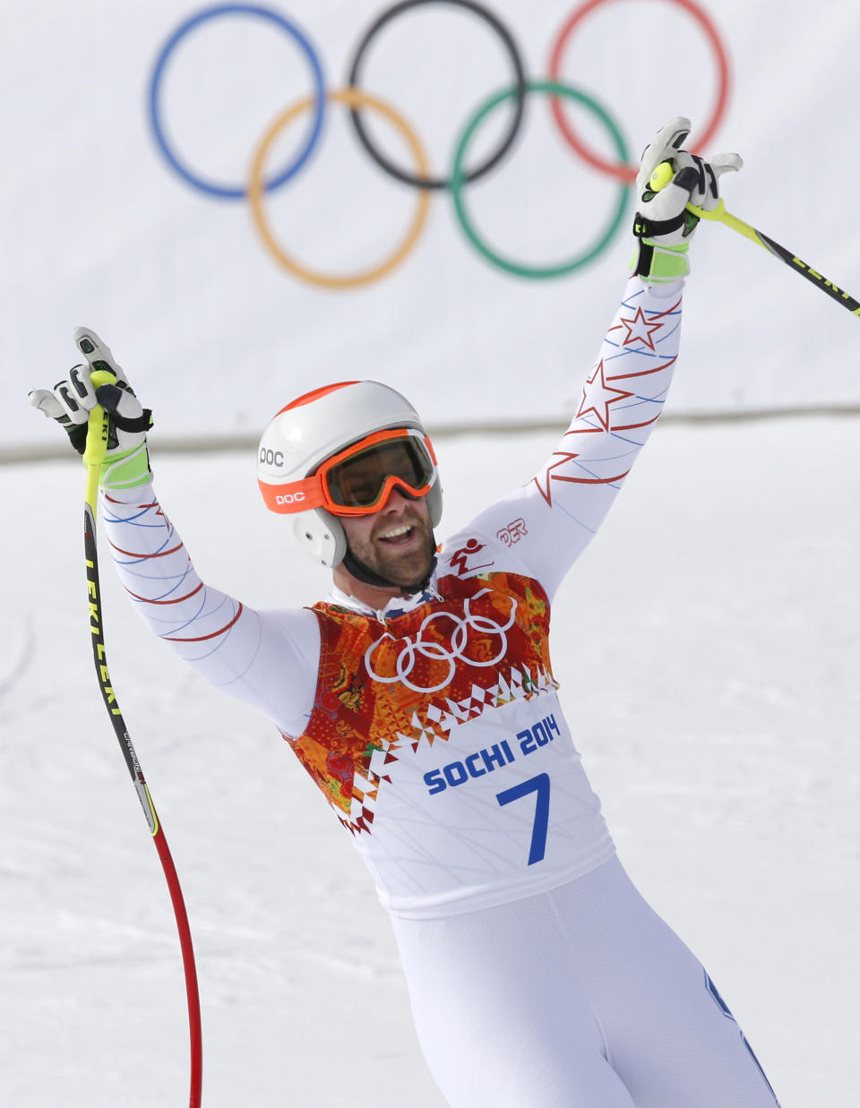 FILE - United States' Travis Ganong gestures after finishing the men's downhill at the Sochi 2014 Winter Olympics, Sunday, Feb. 9, 2014, in Krasnaya Polyana, Russia. Ganong announced Thursday, March 2, 2023, his journey on ski racing’s World Cup carousel ends after the season. (AP Photo/Christophe Ena, File)