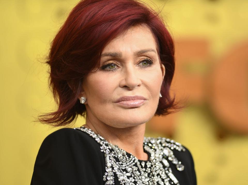 Former X Factor judge Sharon Osbourne was seen in the line comforting other mourners (AFP via Getty Images)