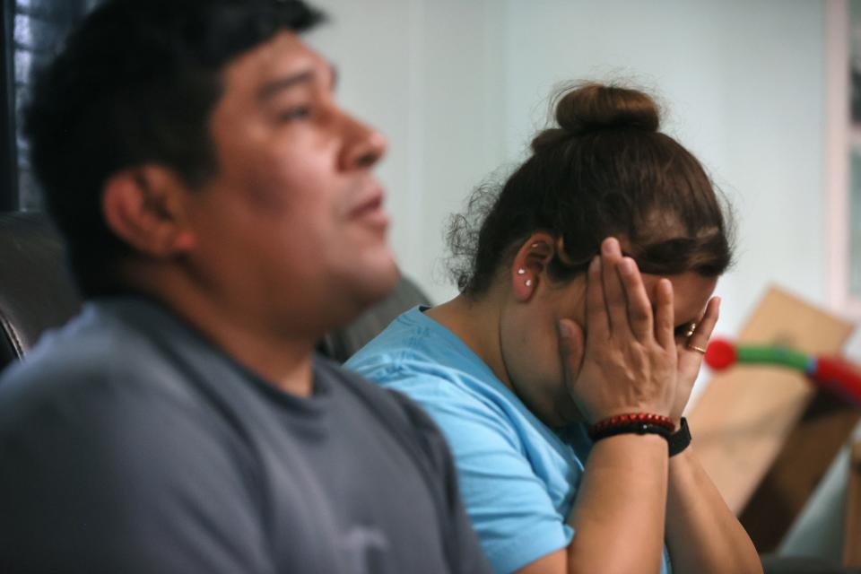 Gelacio Juarez sits with his wife Martha Hernandez as she wipes away tears while discussing his back injury at their Collierville home on Friday, April 22, 2022. Juarez said he still suffers severe pain from the injury.