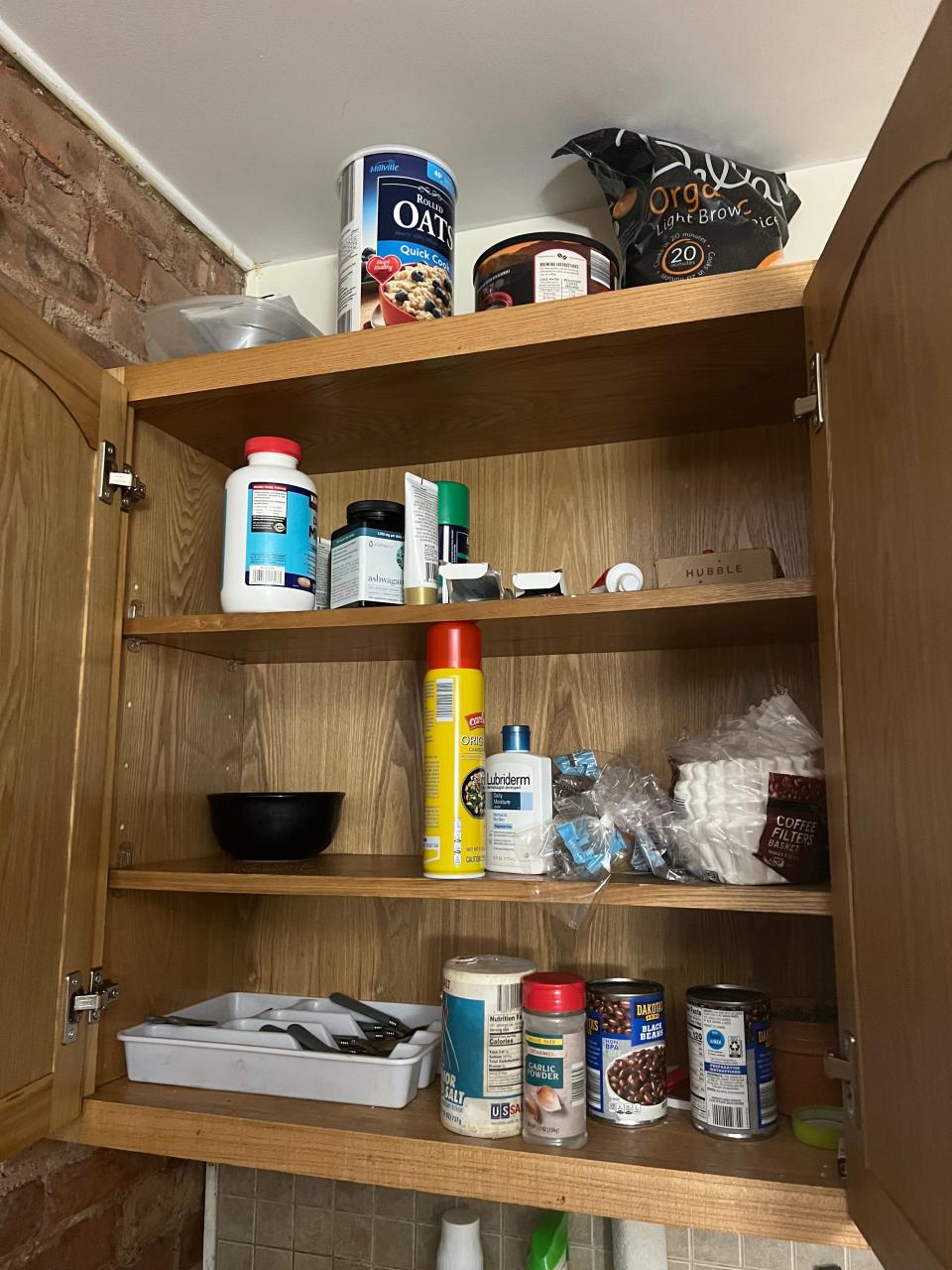 A storage cabinet on the wall of Ron Ervin's 100-square-foot home.