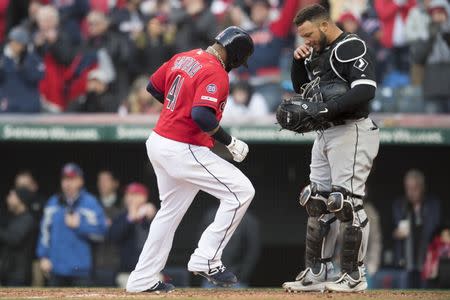 Apr 1, 2019; Cleveland, OH, USA; Cleveland Indians first baseman Carlos Santana (41) scores on an RBI walk as Chicago White Sox catcher Welington Castillo (21) reacts during the eighth inning at Progressive Field. Mandatory Credit: Ken Blaze-USA TODAY Sports
