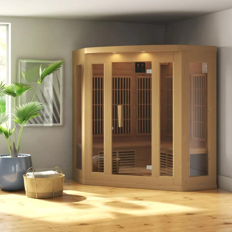 wood sauna in corner of room