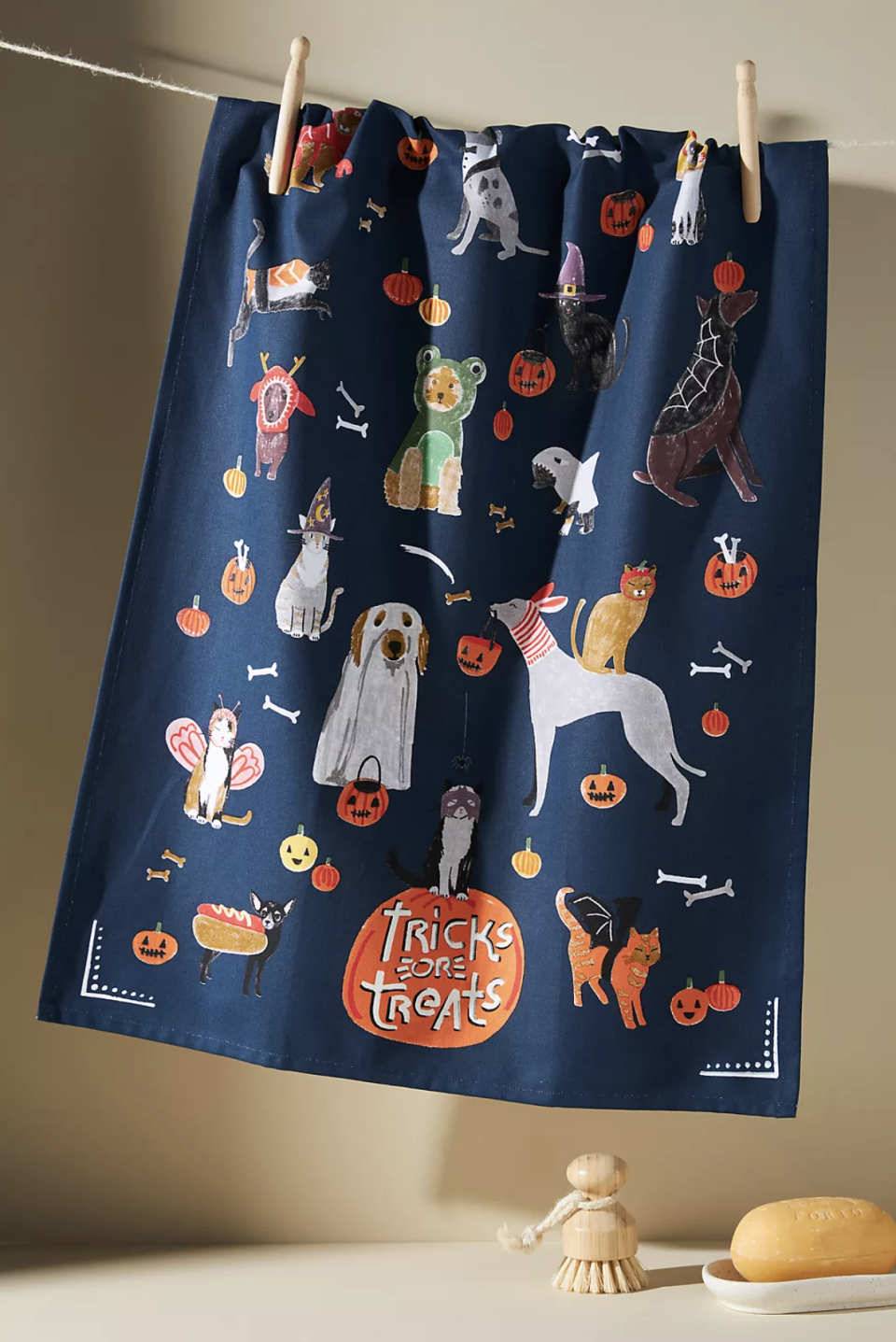 navy blue Tricks or Treats Dish Towel with orange pumpkin