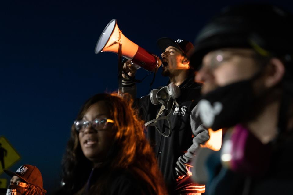 Protesters gather outside the Brooklyn Center Police Department calling for justice for Daunte Wright.