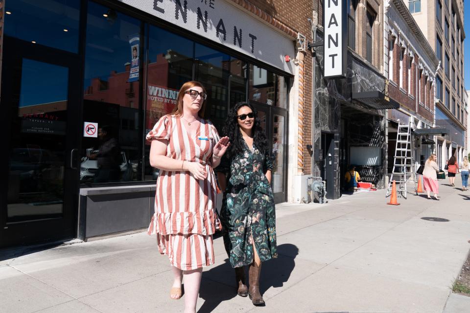 Kate Garren, Visit Topeka executive coordinator, left, leads Vivian Tarn to talk with local media Friday about what she had been looking forward to during her free trip to Topeka from New York.