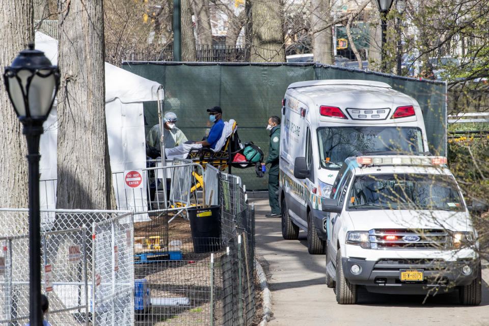 A patient arrives at the Samaritan's Purse field hospital in New York's Central Park, , Wednesday, April 1, 2020. The new coronavirus causes mild or moderate symptoms for most people, but for some, especially older adults and people with existing health problems, it can cause more severe illness or death. (AP Photo/Mary Altaffer)