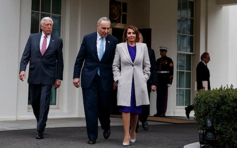 Chuck Schumer and Nancy Pelosi, the most senior Democrats in the Senate and House of Representatives, leave White House talks about the shutdown together - Credit: AP Photo/Evan Vucci