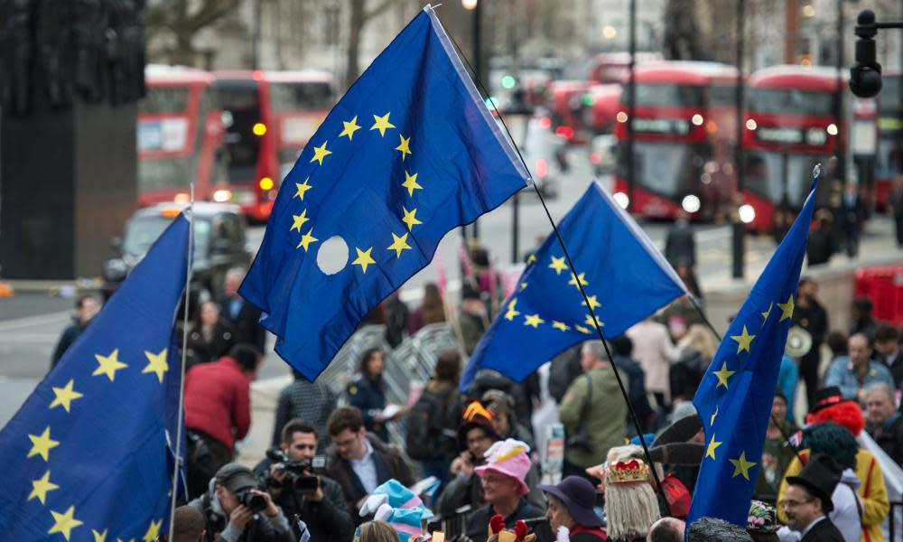 Protesters march on Downing Street with EU flags. Davis says article 50 letter not a threat to union.