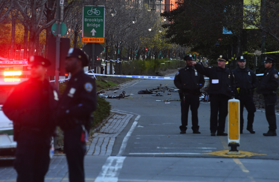 Police observe the aftermath of the New York attack (Picture: REX)