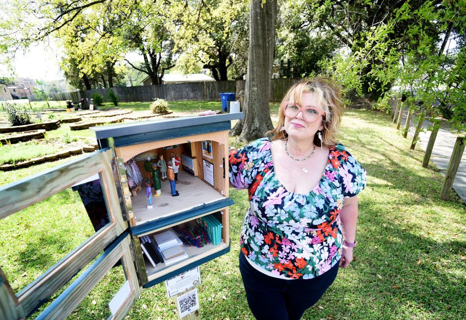 Noel Community Arts Program Executive Director Tracy McComic stands next to the Free Little Art Gallery on Herndon St. Thursday afternoon, March 14, 2024.