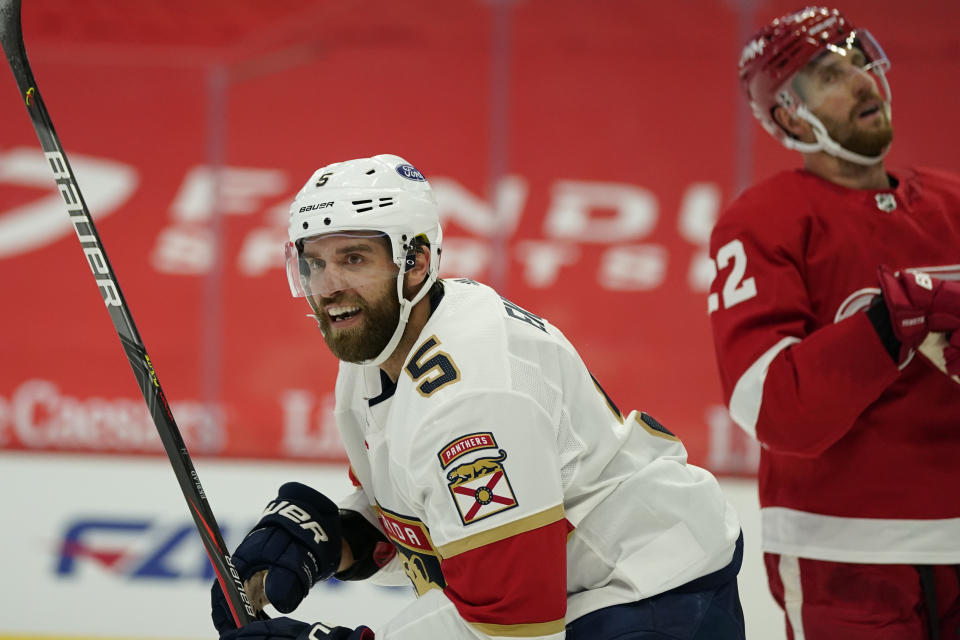 Florida Panthers defenseman Aaron Ekblad (5) reacts after teammate Keith Yandle scored a goal during the first period of an NHL hockey game against the Detroit Red Wings, Saturday, Jan. 30, 2021, in Detroit. (AP Photo/Carlos Osorio)