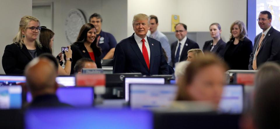 President Donald Trump tours&nbsp;Federal Emergency Management Agency headquarters after an Aug. 4 briefing on hurricane season. (Photo: Carlos Barria / Reuters)