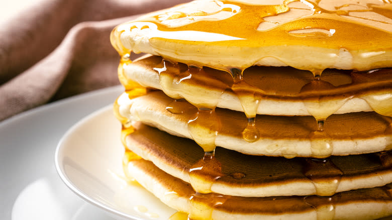 pancakes dripping with syrup