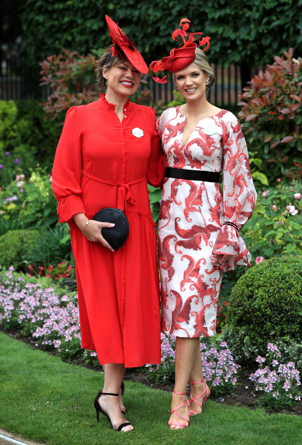 TV presenters Kate Silverton Charlotte Hawkins. Charlotte wears an Amanda Wakeley dress from Fenwick (<a href="https://fave.co/2Ro3DAj" rel="noopener" target="_blank" data-ylk="slk:currently on sale for £865;elm:context_link;itc:0;sec:content-canvas" class="link ">currently on sale for £865</a>) with a Siana Yewdall hat while Kate wears a <a href="https://fave.co/2x2HbDl" rel="noopener" target="_blank" data-ylk="slk:£450 Beulah London;elm:context_link;itc:0;sec:content-canvas" class="link ">£450 Beulah London</a> dress. <em>[Photo: PA]</em>