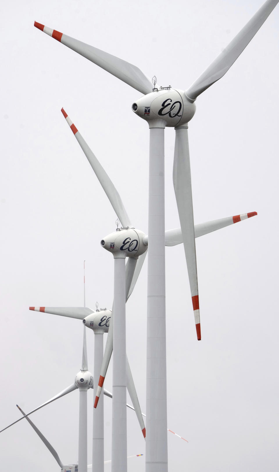 Wind turbines turn near the village of Feldheim near Treuenbrietzen, Germany, Wednesday, Sept. 28, 2022. Located about an hour and a half south of Berlin, the village of Feldheim has been energy self-sufficient for more than a decade. (AP Photo/Michael Sohn)