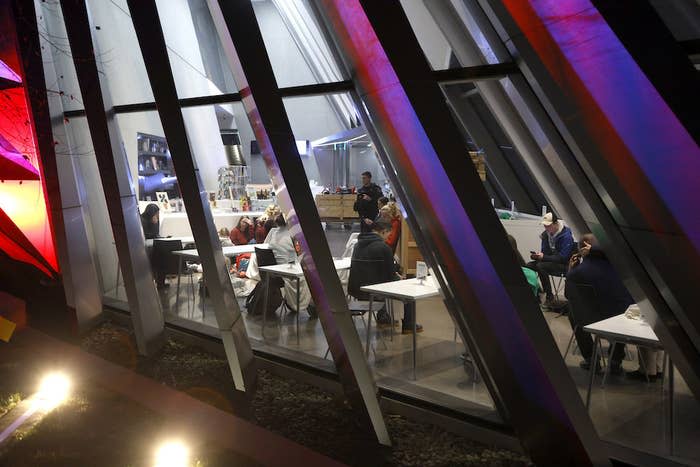 People are seen inside the Broad Art Museum near Berkey Hall on the campus of Michigan State University as they shelter in place.