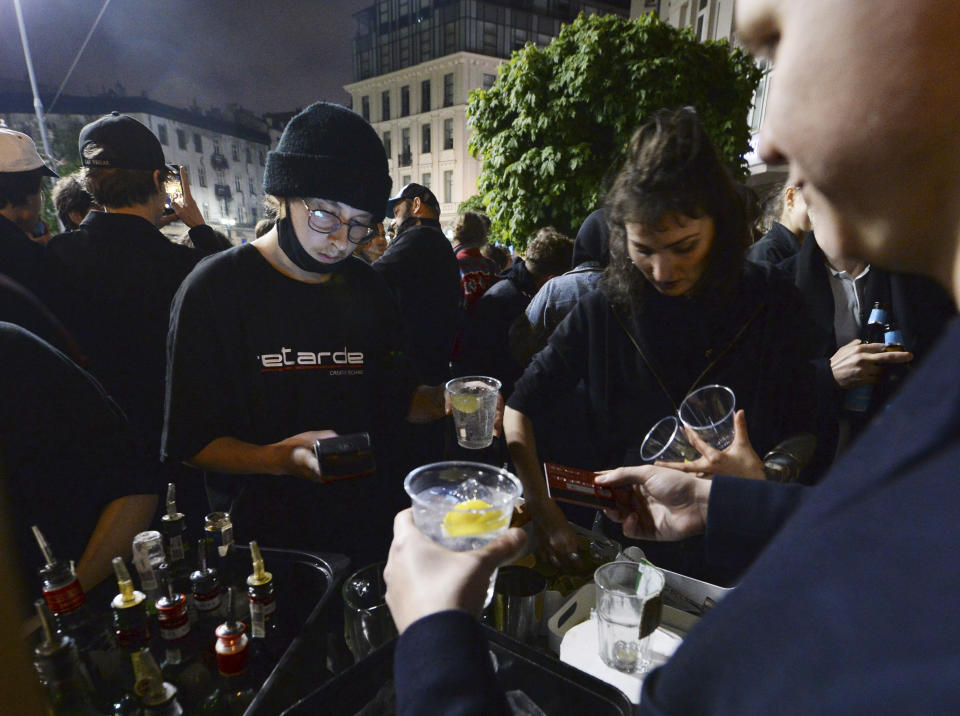 People gather and celebrate as bars, clubs and other establishments reopened in Poland after being closed for seven months, in Warsaw, Poland, Friday, May 14, 2021. (AP Photo/Czarek Sokolowski)