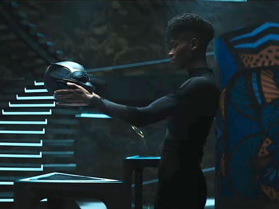 Shuri holding the Black Panther mask in "Black Panther: Wakanda Forever."