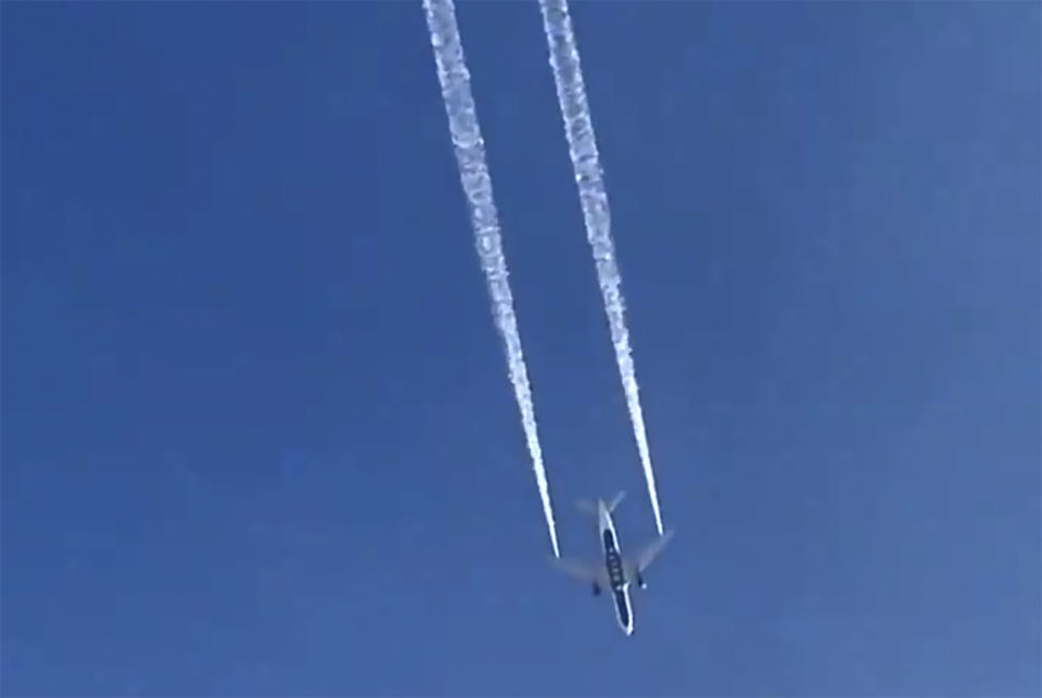 In this image from video, Delta Air Lines Flight 89 to Shanghai, China dumps fuel over Los Angeles before returning to Los Angeles International Airport for an emergency landing Tuesday, Jan. 14, 2020. Fire officials say fuel apparently dumped by the aircraft returning to LAX fell onto an elementary school playground. A fire department tweet says firefighters are assessing "multiple patients" at the school in the suburban city of Cudahy, Calif. The flight tracking website FlightAware shows that Delta Air Lines Flight 89 to Shanghai, China, departed LAX, circled back over Southern California and returned to the airport. (AP Photo/Matt Hartman)