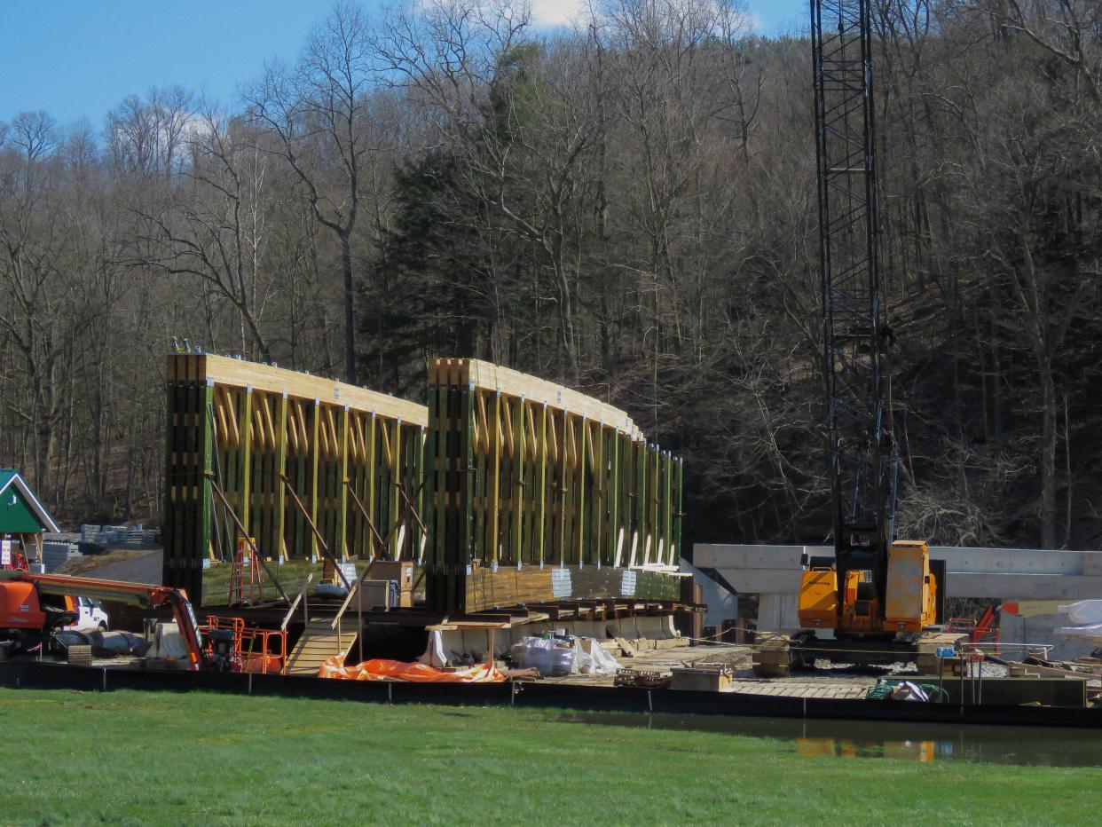 Bridge sections for the new Spellacy Covered Bridge await installation on the bank of the Mohican River between Loudonville and Greer.