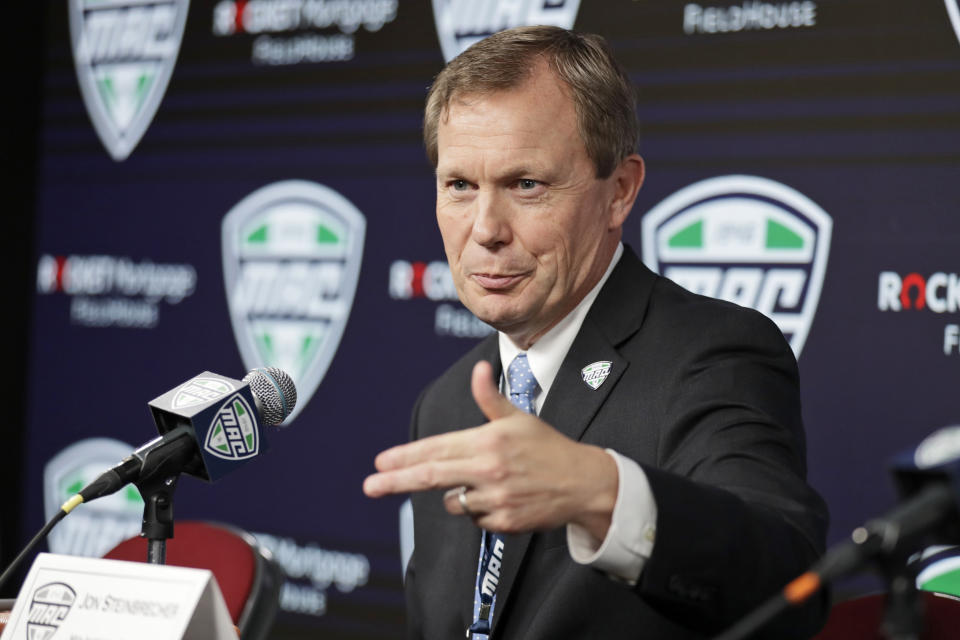 Mid-American Conference commissioner Jon Steinbrecher speaks to the media, Thursday, March 12, 2020, in Cleveland. The Mid-American Conference basketball tournament was cancelled Thursday, at an arena scheduled to be the site of NCAA men's tournament games next week .(AP Photo/Tony Dejak)