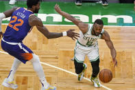 Boston Celtics guard Kemba Walker (8) drives against Phoenix Suns center Deandre Ayton (22) during the second half of an NBA basketball game Thursday, April 22, 2021, in Boston. (AP Photo/Elise Amendola)