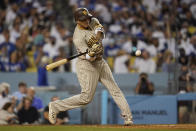 San Diego Padres' Manny Machado flies out to center during the fifth inning of a baseball game against the Los Angeles Dodgers Friday, Sept. 10, 2021, in Los Angeles. (AP Photo/Ashley Landis)