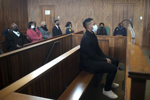 South Africa rugby player Elton Jantjies, center, appears in Kempton Park magistrates court in Johannesburg on May 16. Jantjies was arrested for allegedly causing damage to an aircraft during a flight home from a vacation in Turkey. (Photo: Associated Press)