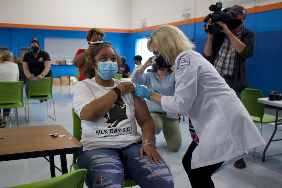 Lt. Governor Bethany Hall-Long vaccinates Anaya Patterson, 17, at The Warehouse vaccination event in northeast Wilmington on Sunday, May 16, 2021.