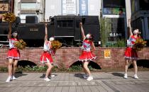 Cheerleaders perform at Shimbashi Station one day before Tokyo 2020 Olympics