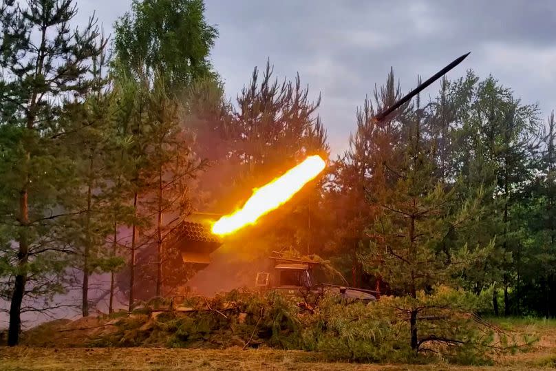 In this photo taken from video released by the Russian Defence Ministry on Tuesday, Russian Army BM-21 Grad self-propelled launcher fires rockets in undisclosed location