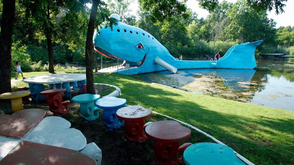 A visitor walks up to the Blue Whale, a classic Route 66 landmark and curiosity, in Catoosa, Oklahoma, 04 July 2003.