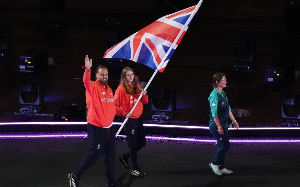 Great Britain's Matt Bush and Poppy Maskill with the flag during the closing ceremony