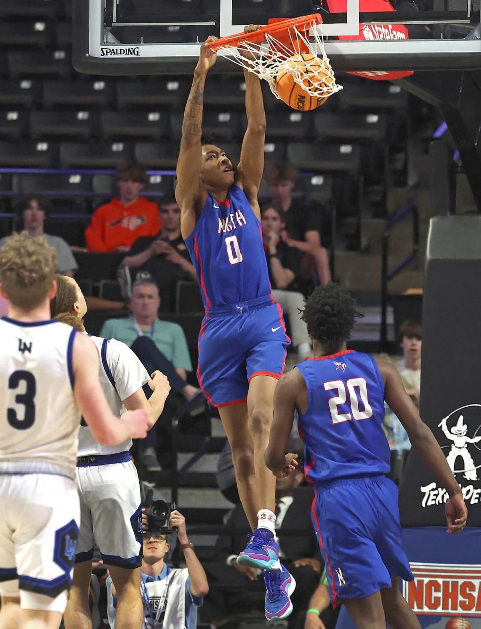 North Meck’s Isaiah Evans throws down a two-handed dunk during first-quarter action against Lake Norman in the 4A NCHSAA Regional Championship game on Thursday, March 14, 2024 at Lawrence Joel Veterans Memorial Coliseum in Winston-Salem, NC. JEFF SINER/jsiner@charlotteobserver.com