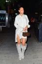 <p>The singer stepped out last night in NYC wearing a long-sleeved shirtdress, Louis Vuitton box bag, knee-high fur boots, a chain necklace and hoop earrings. </p>