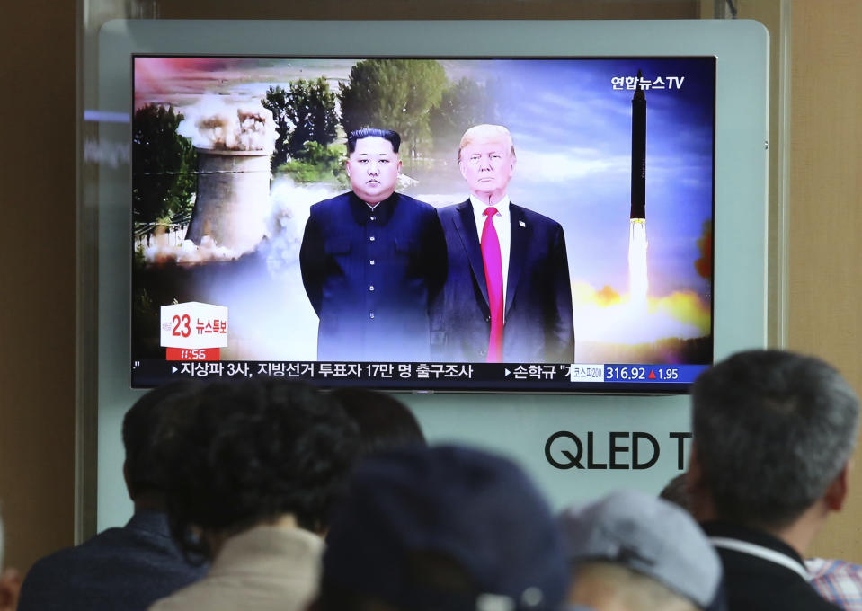 People watch a TV screen showing file footage of U.S. President Donald Trump, right, and North Korean leader Kim Jong Un during a news program at Seoul Railway Station in Seoul, South Korea, Monday, June 11, 2018. Final preparations are underway in Singapore for Tuesday’s historic summit between President Trump and North Korean leader Kim, including a plan for the leaders to kick things off by meeting with only their translators present, a U.S. official said. (AP Photo/Ahn Young-joon)