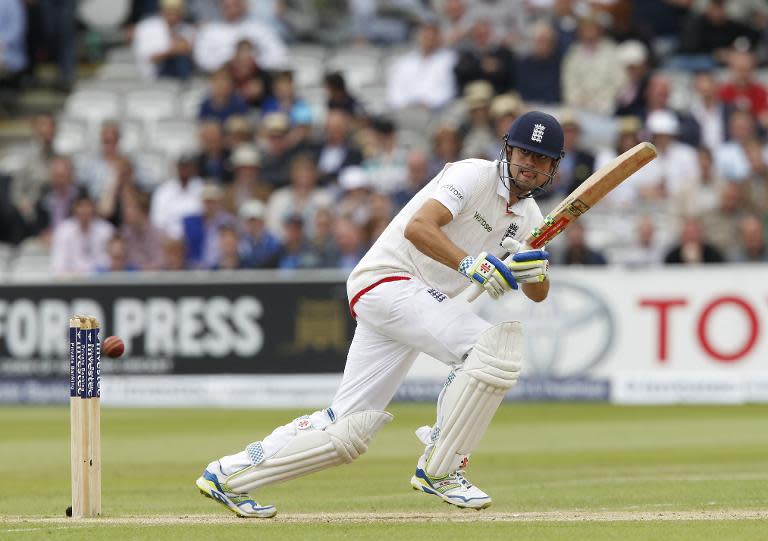 England captain Alastair Cook hits a shot on the fourth day of the first Test against New Zealand at Lord's cricket ground on May 24, 2015