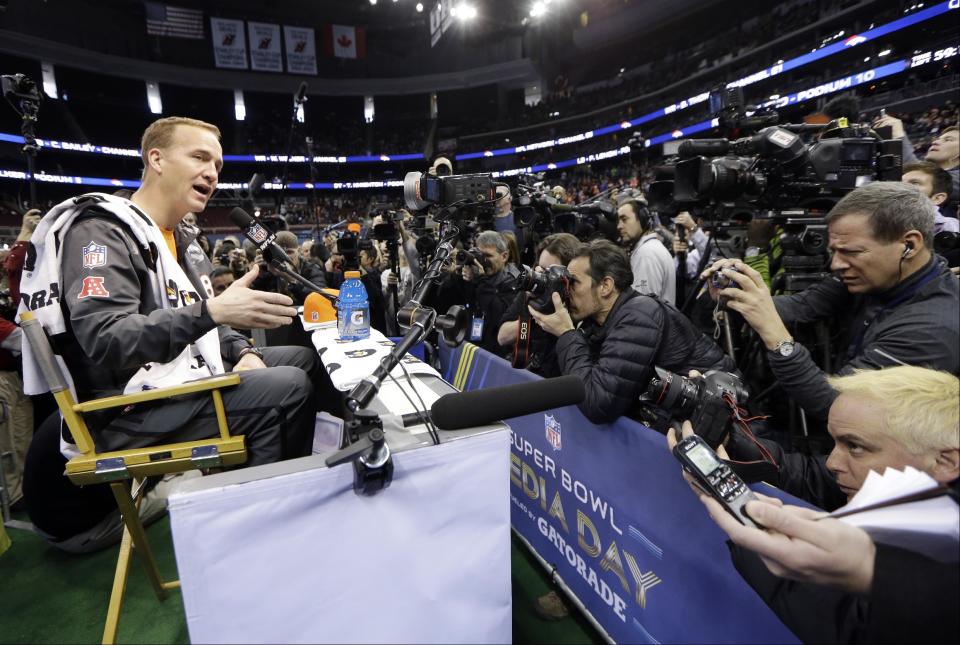 Denver Broncos' Peyton Manning answers a question during media day for the NFL Super Bowl XLVIII football game Tuesday, Jan. 28, 2014, in Newark, N.J. (AP Photo/Mark Humphrey)