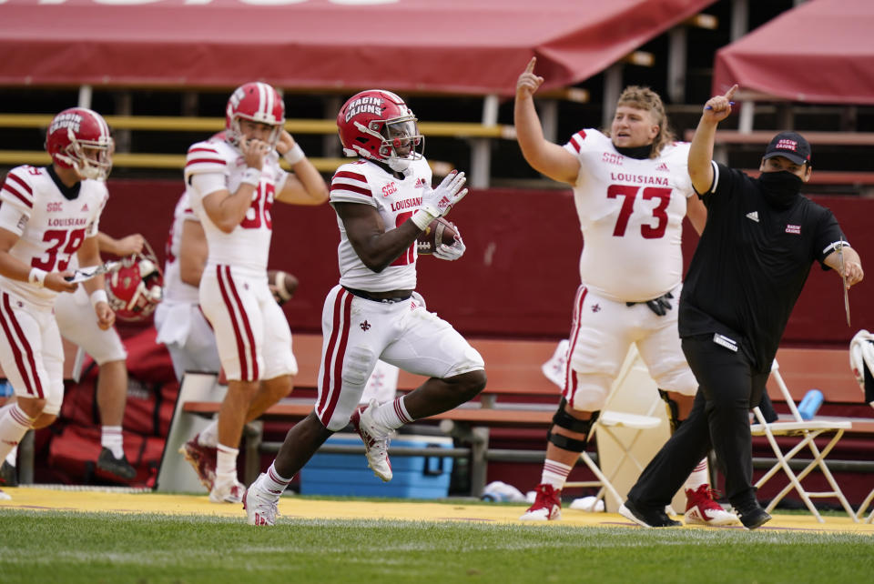 Louisiana-Lafayette running back Chris Smith, center, returns a kickoff 95-yards for a touchdown during the first half of an NCAA college football game against Iowa State, Saturday, Sept. 12, 2020, in Ames, Iowa. (AP Photo/Charlie Neibergall)