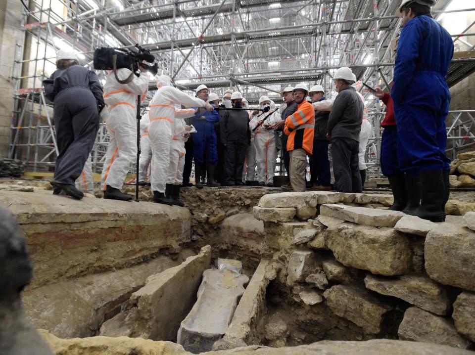 France's Culture Minister Roselyne Bachelot (C, left) visits the Notre Dame Cathedral archeological research site in Paris on March 15, 2022.