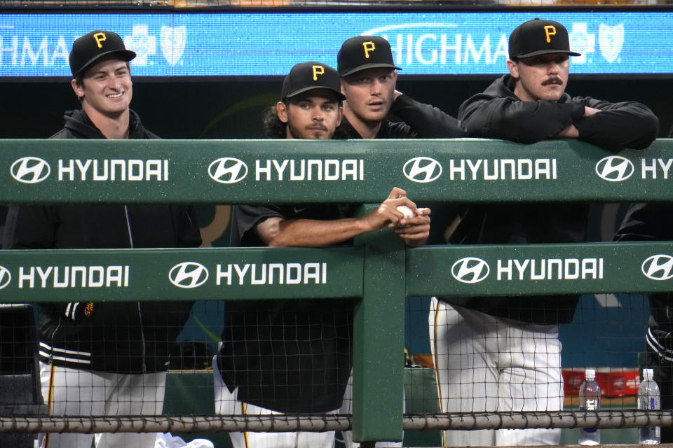 From left to right, Pittsburgh Pirates starting pitchers Quinn Priester, Jared Jones, Mitch Keller and Paul Skenes stand in the dugout during the seventh inning of a baseball game against the Chicago Cubs in Pittsburgh, Saturday, May 11, 2024. The game was Skenes' major league debut. (AP Photo/Gene J. Puskar)