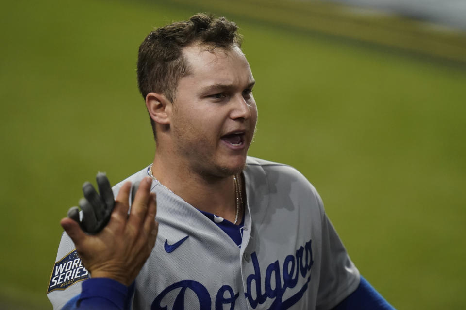 Los Angeles Dodgers' Joc Pederson celebrates a home run against the Tampa Bay Rays during the second inning in Game 5 of the baseball World Series Sunday, Oct. 25, 2020, in Arlington, Texas. (AP Photo/Eric Gay)