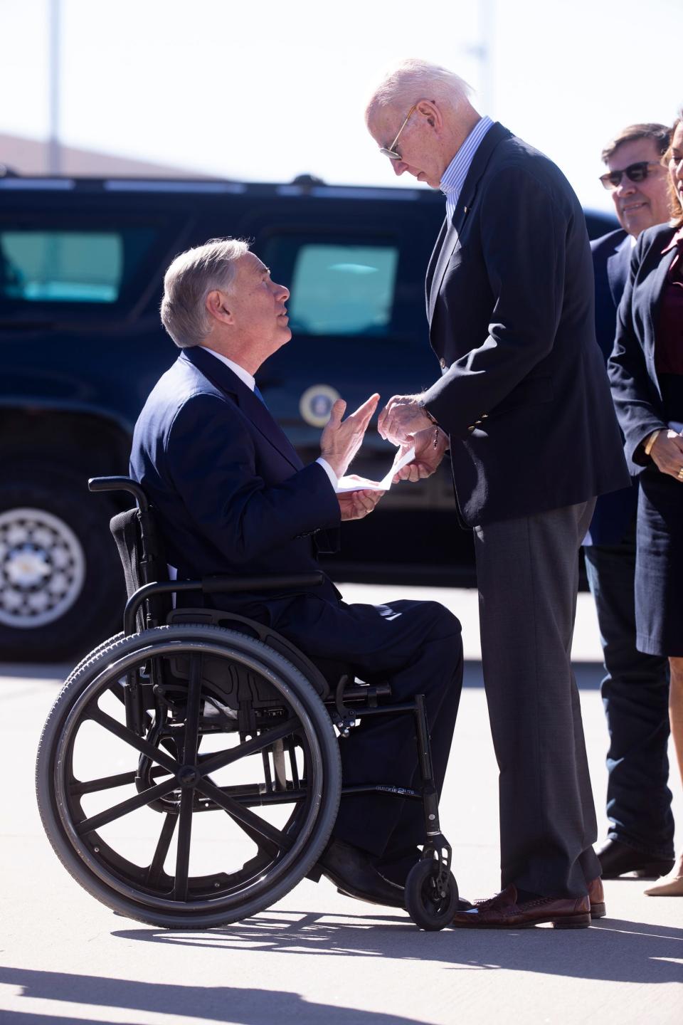 Texas Gov. Abbott hands a letter to President Joe Biden during the president’s arrival in El Paso, Texas on Jan. 8, 2022. The president visited the border city prior to heading the to North American Summit in Mexico City. 