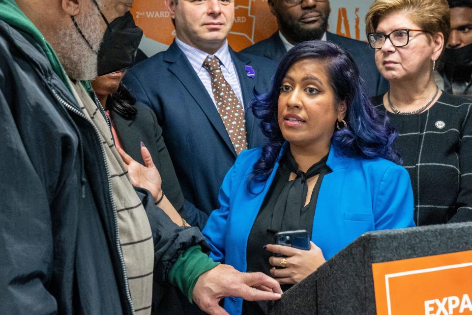 Dr. Liza Chowdhury, the Executive Director of Reimagining Justice, speaks to Alonzo Moody at the Reimagining Justice and Paterson Healing Collective office in Paterson, NJ on Thursday, Jan 19, 2023. 